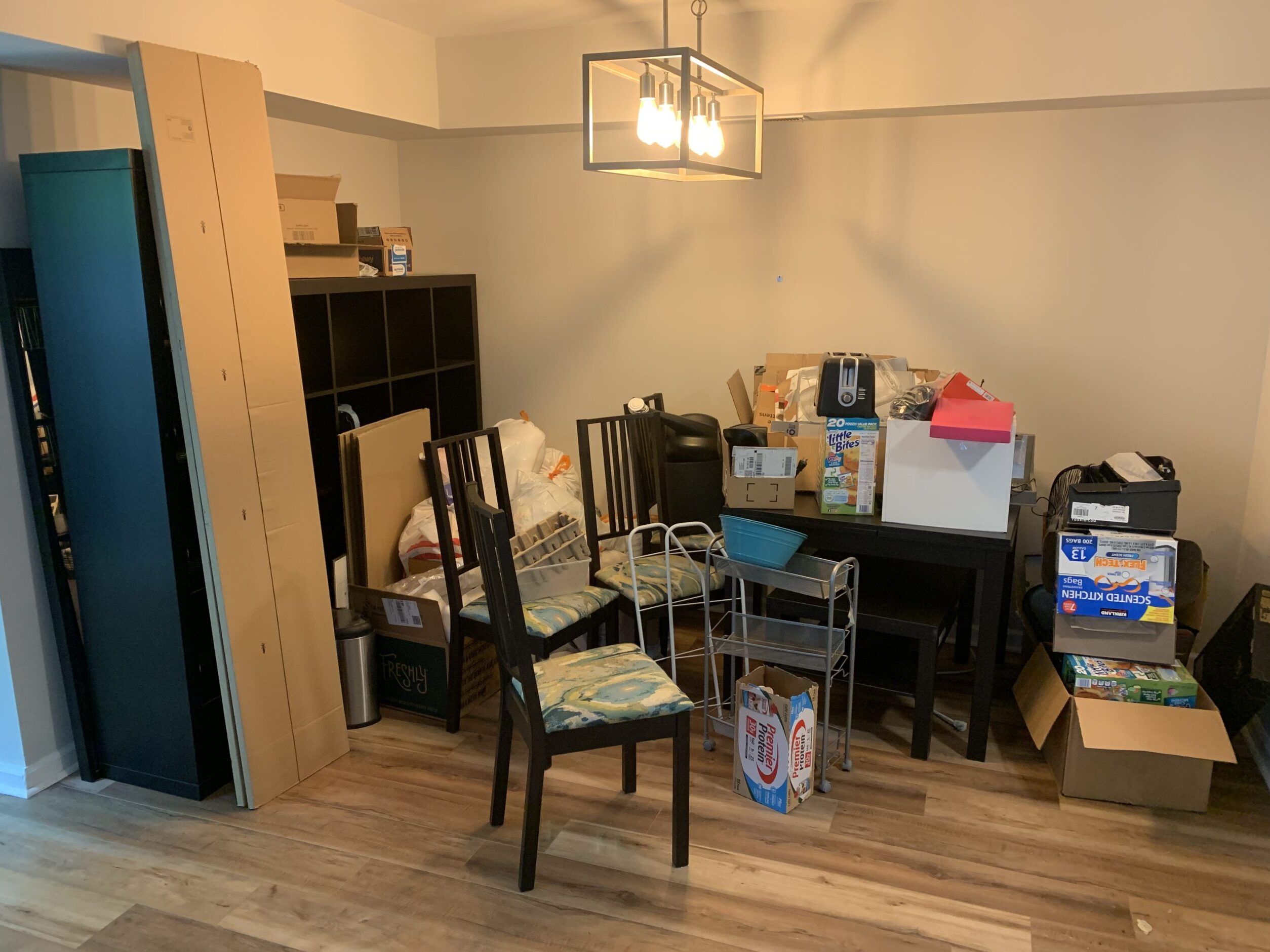 kitchen area with junk piled before removal