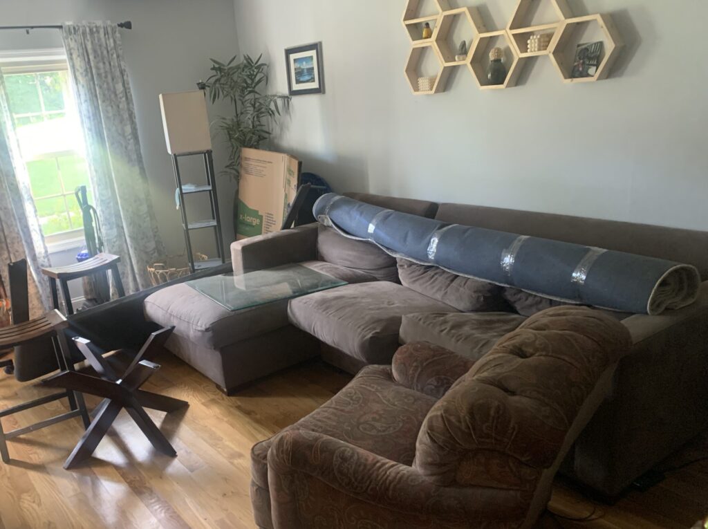 family room area with couch before cleanup